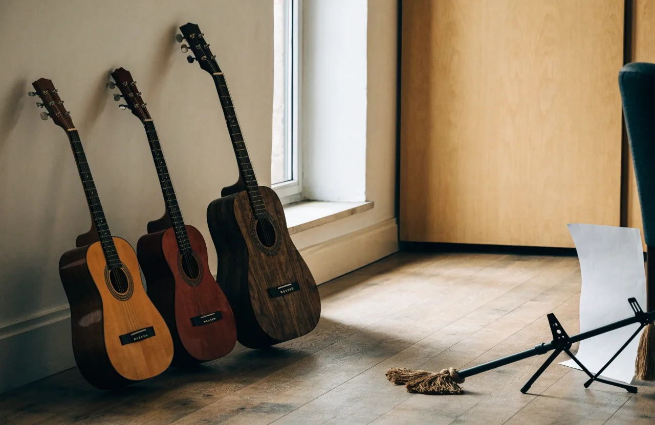 A narrow London street at late afternoon with a guitar resting in a music shop window recess